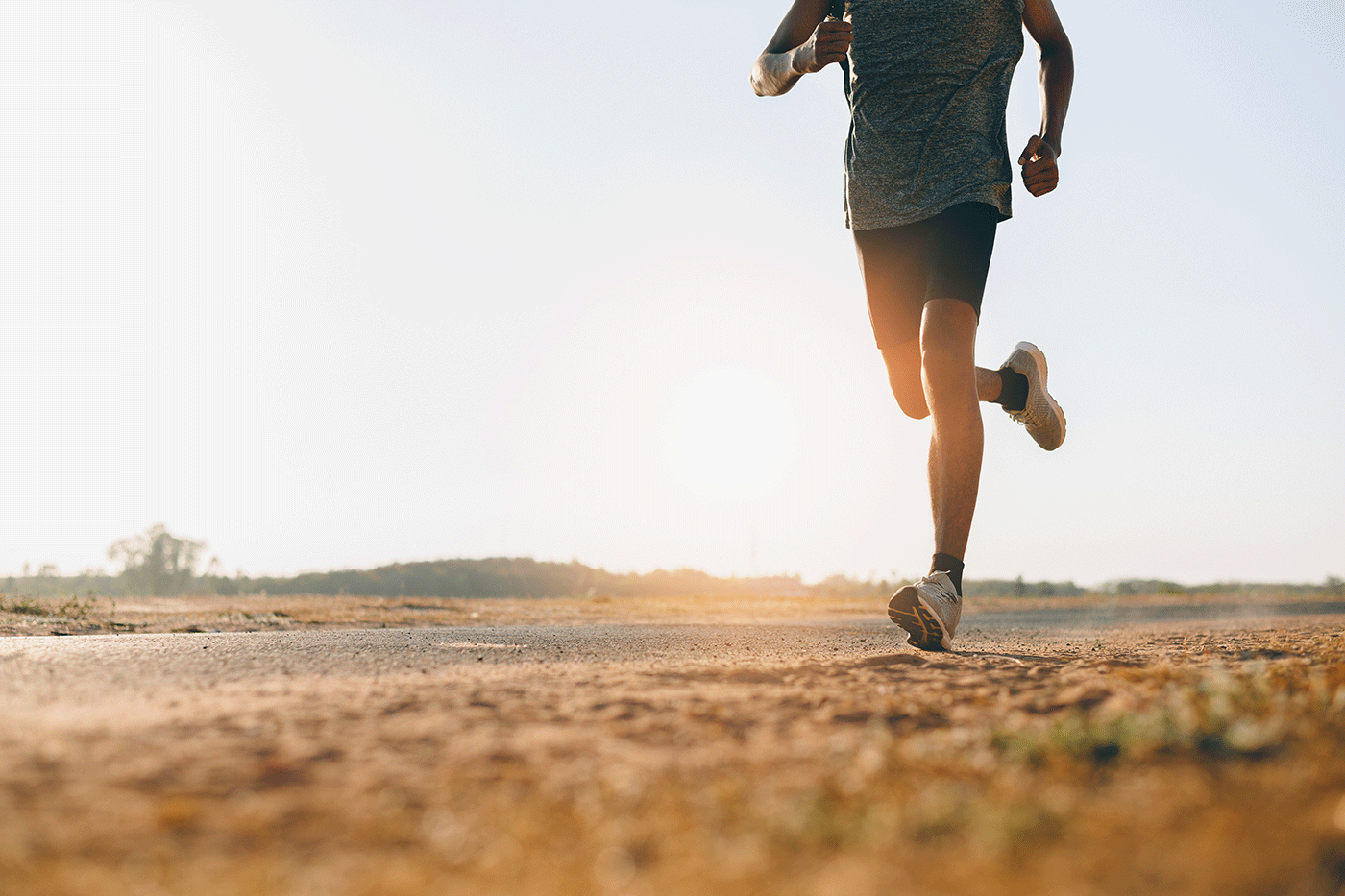 Athlete runner feet running on road, Jogging at outdoors. Man running for exercise. Sports and healthy lifestyle concept.