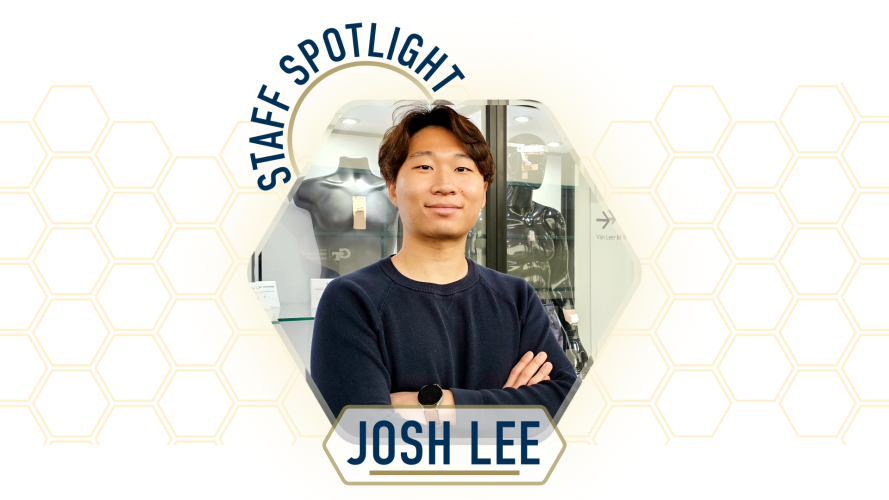 Staff Spotlight: Josh Lee standing with arms crossed in front of a wearable technology display.  Graphic with hexagonal design elements and the text “Staff Spotlight” and “Josh Lee.”