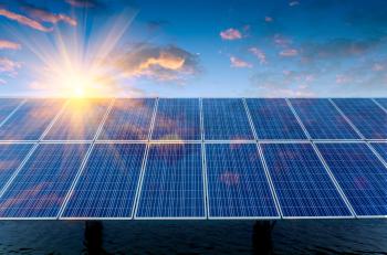 solar panels over water with sun and clouds above